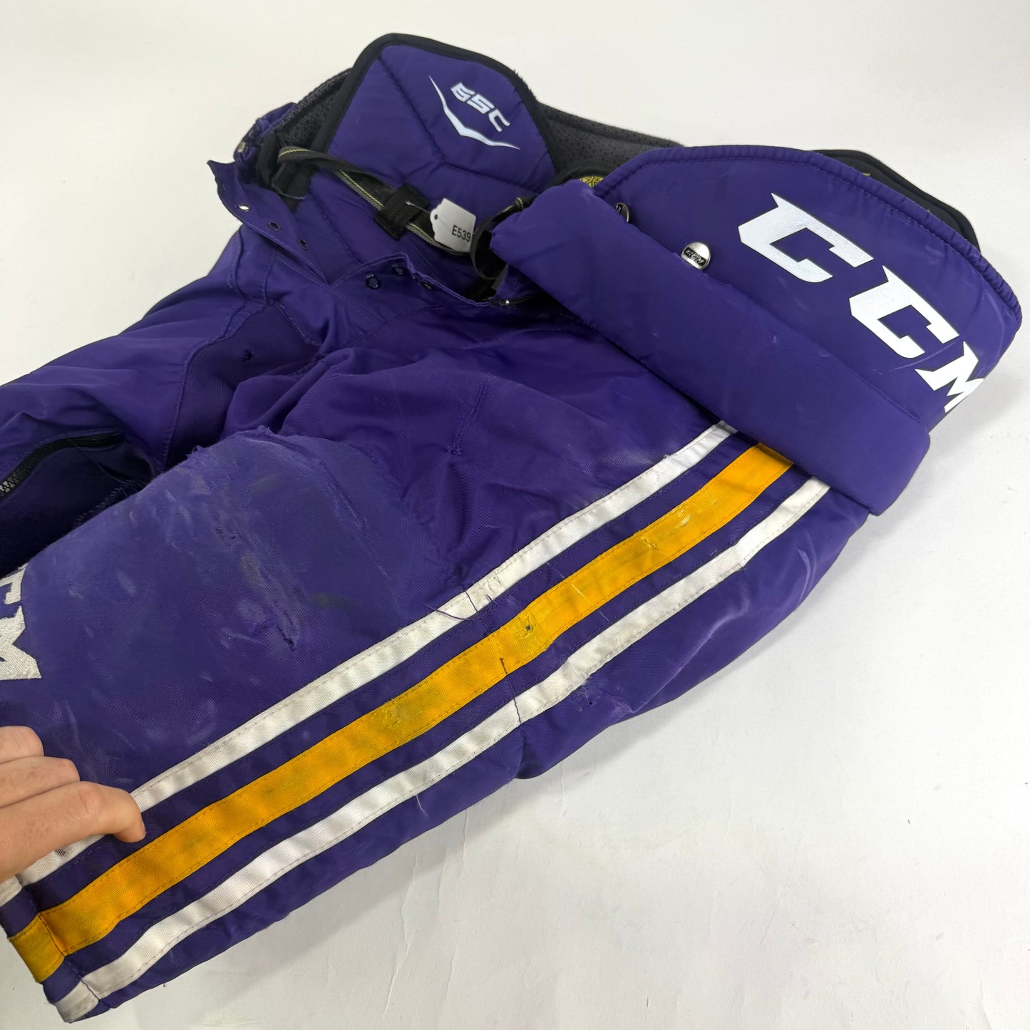 Used Purple/Yellow CCM Tacks 65C Pants | Medium | E539