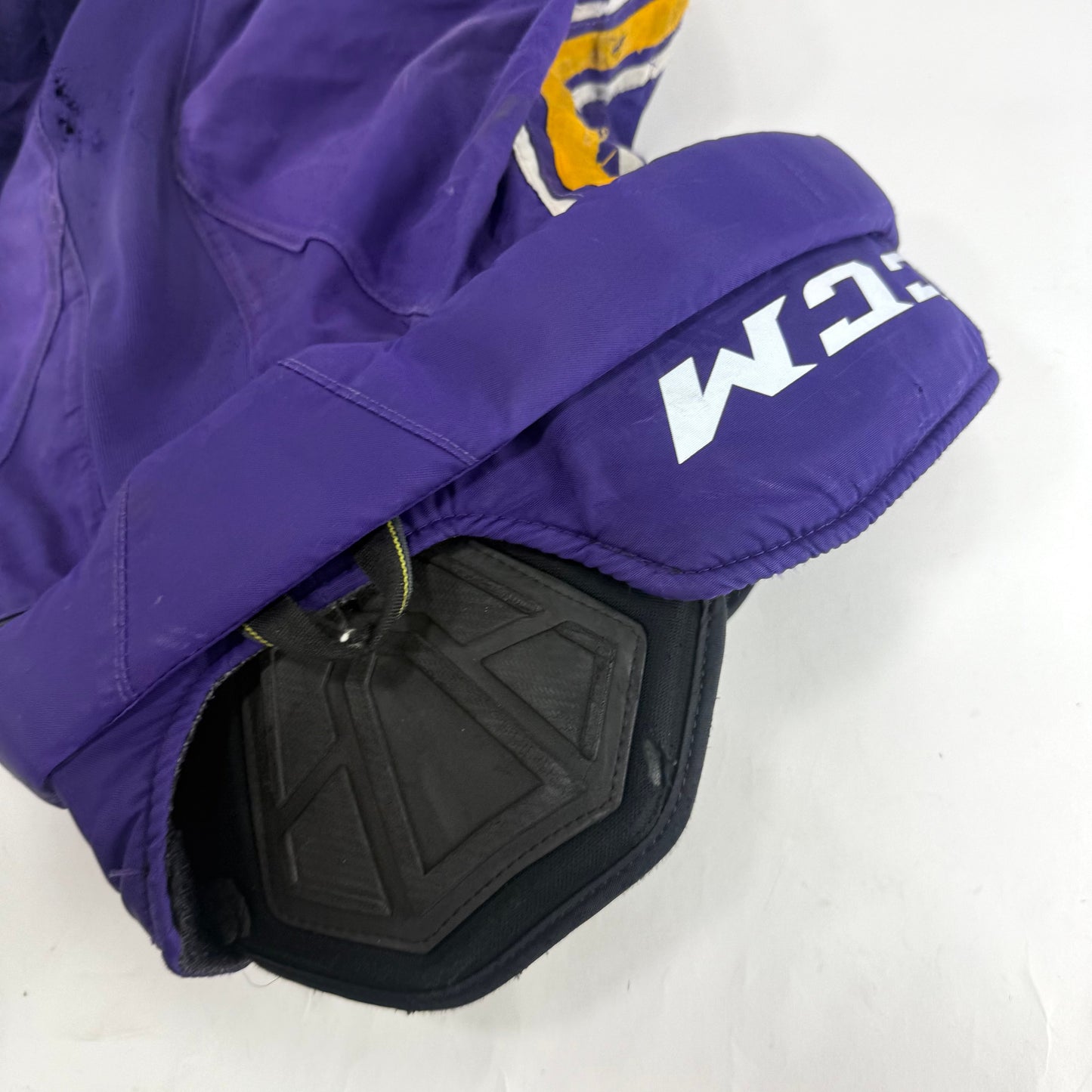 Used Purple/Yellow CCM Tacks 65C Pants | Small | E549