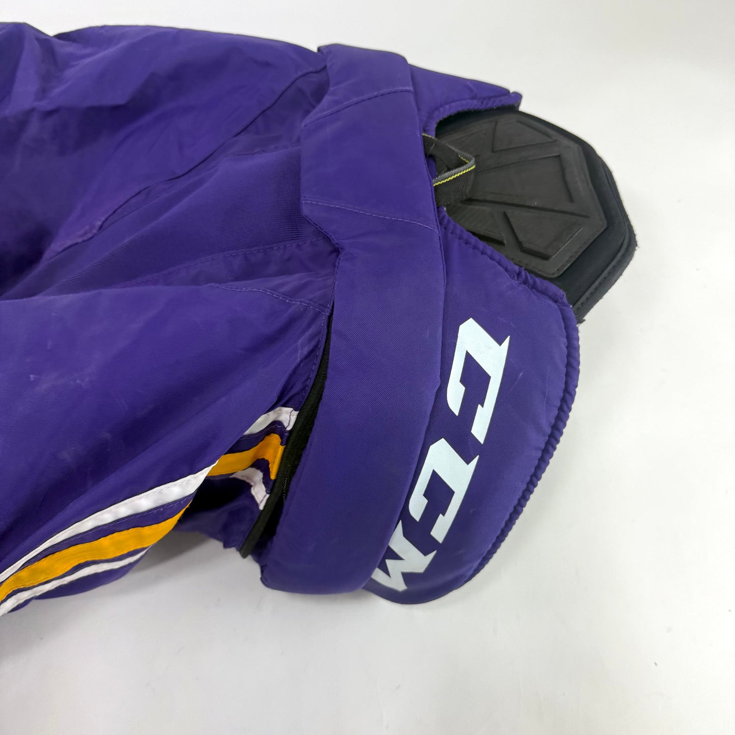 Used Purple/Yellow CCM Tacks 65C Pants | Small | E535 - Top Flight Hockey