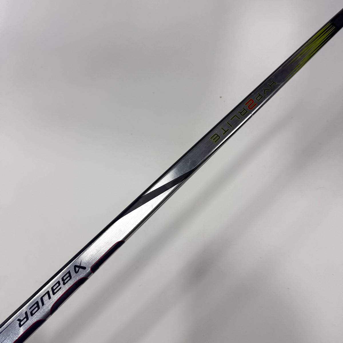 Repaired Left Bauer Vapor Hyperlite 2 | 77 Flex P28 Curve Grip | E680 - Top Flight Hockey