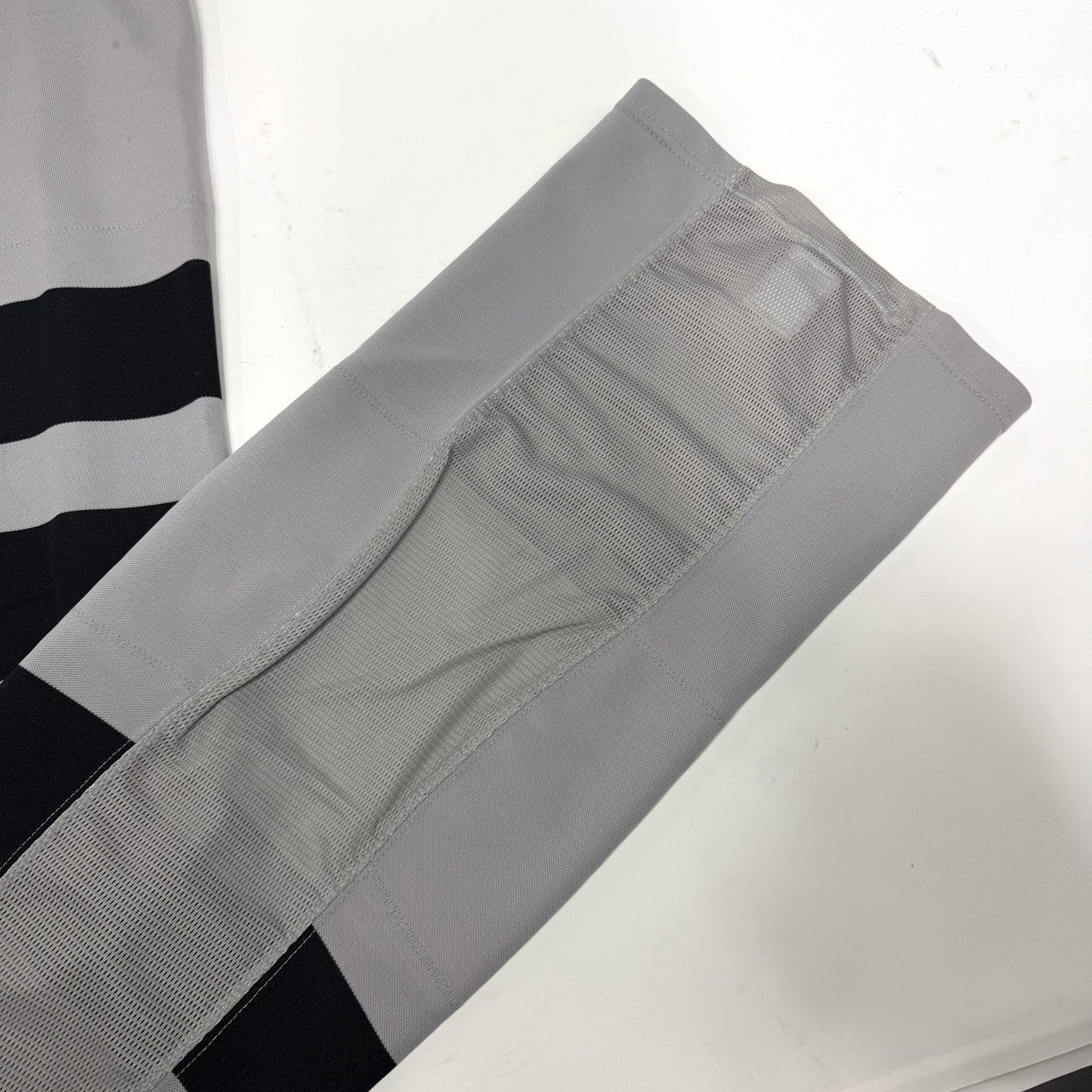 Used Grey and Black Ontario Reign Socks with Velcro | Adult Large