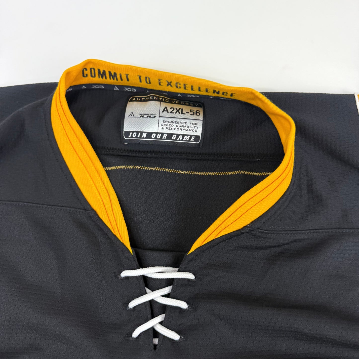 Black JOG Adrian College Game Jersey | Size 56 | Simmons-Fischer #82 - Top Flight Hockey