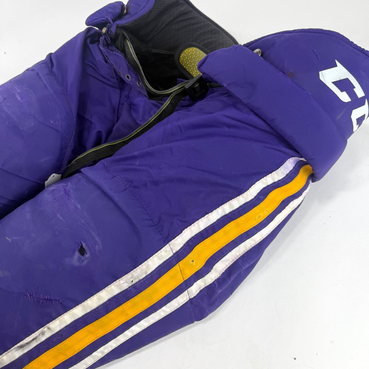 Used Purple/Yellow CCM Tacks 65C Pants | Large | E530