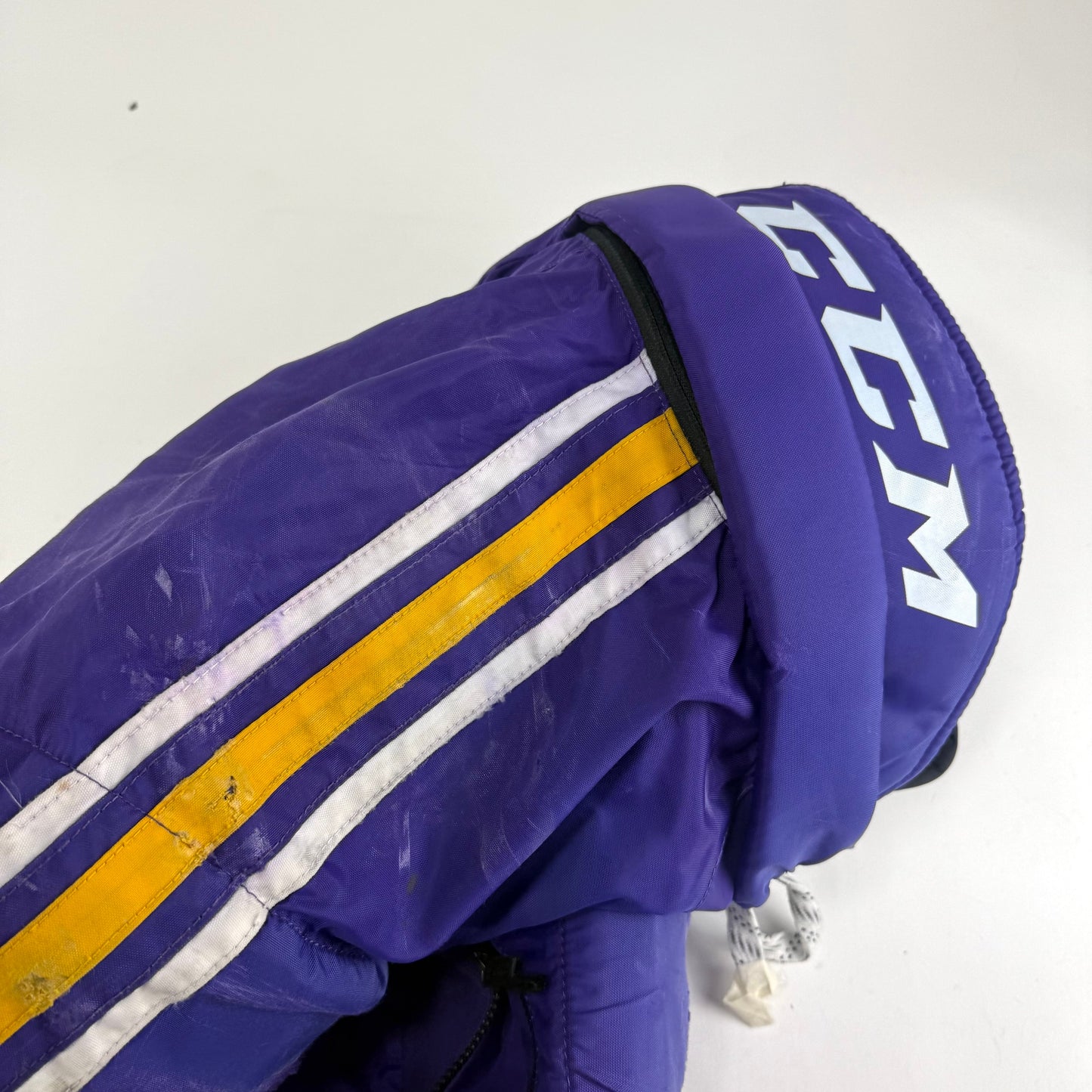 Used Purple/Yellow CCM Tacks 65C Pants | Medium | E552 - Top Flight Hockey