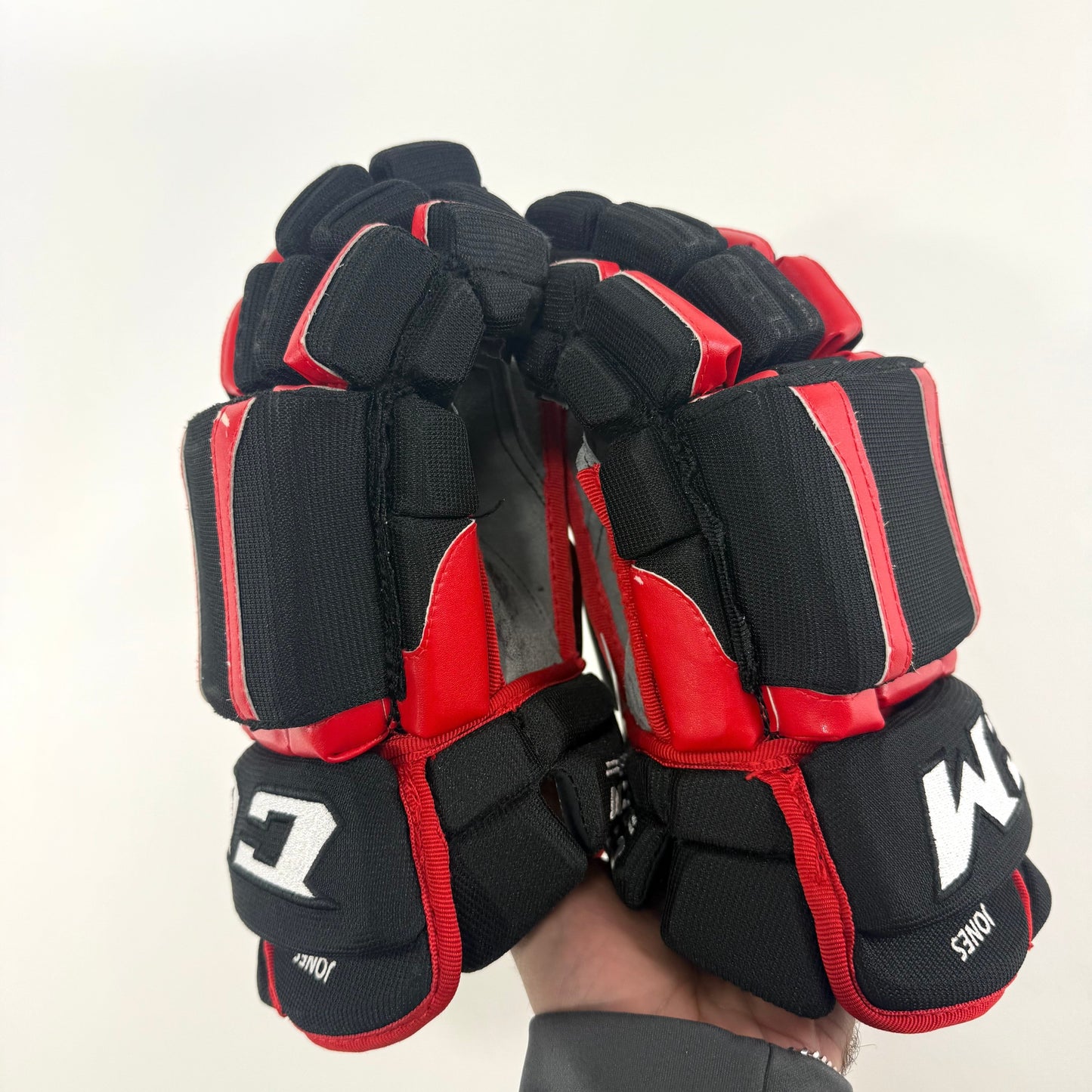 Used Chicago Blackhawks CCM HGCL 13" Gloves | Caleb Jones | L362