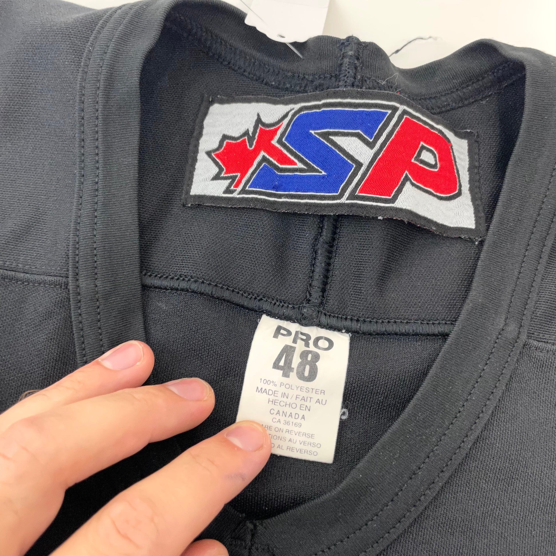 Used Black Adrian SP Practice Jersey | Size 48 | J556 - Top Flight Hockey