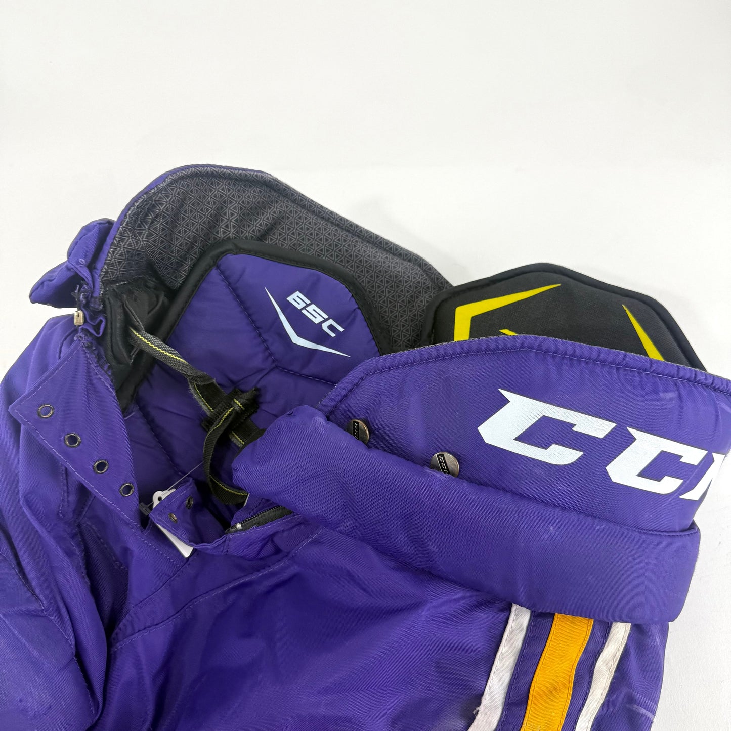 Used Purple/Yellow CCM Tacks 65C Pants | Medium | E539
