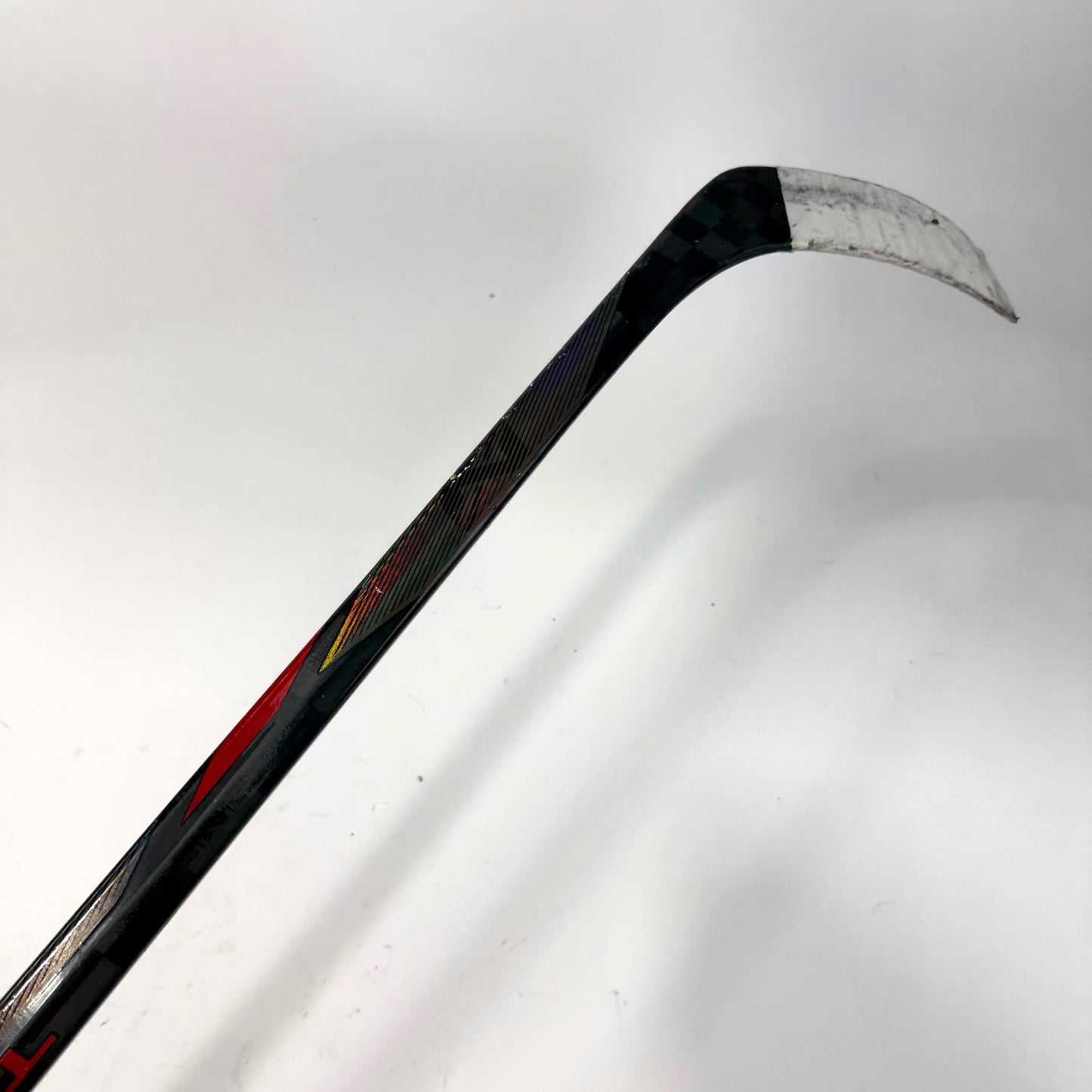 Used Left Red Bauer Nexus Tracer | 55 Flex P28 Curve Grip | AB699