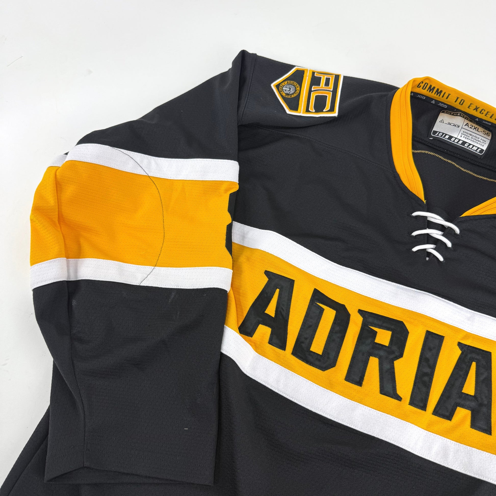 Black JOG Adrian College Game Jersey | Size 56 | Simmons-Fischer #82 - Top Flight Hockey