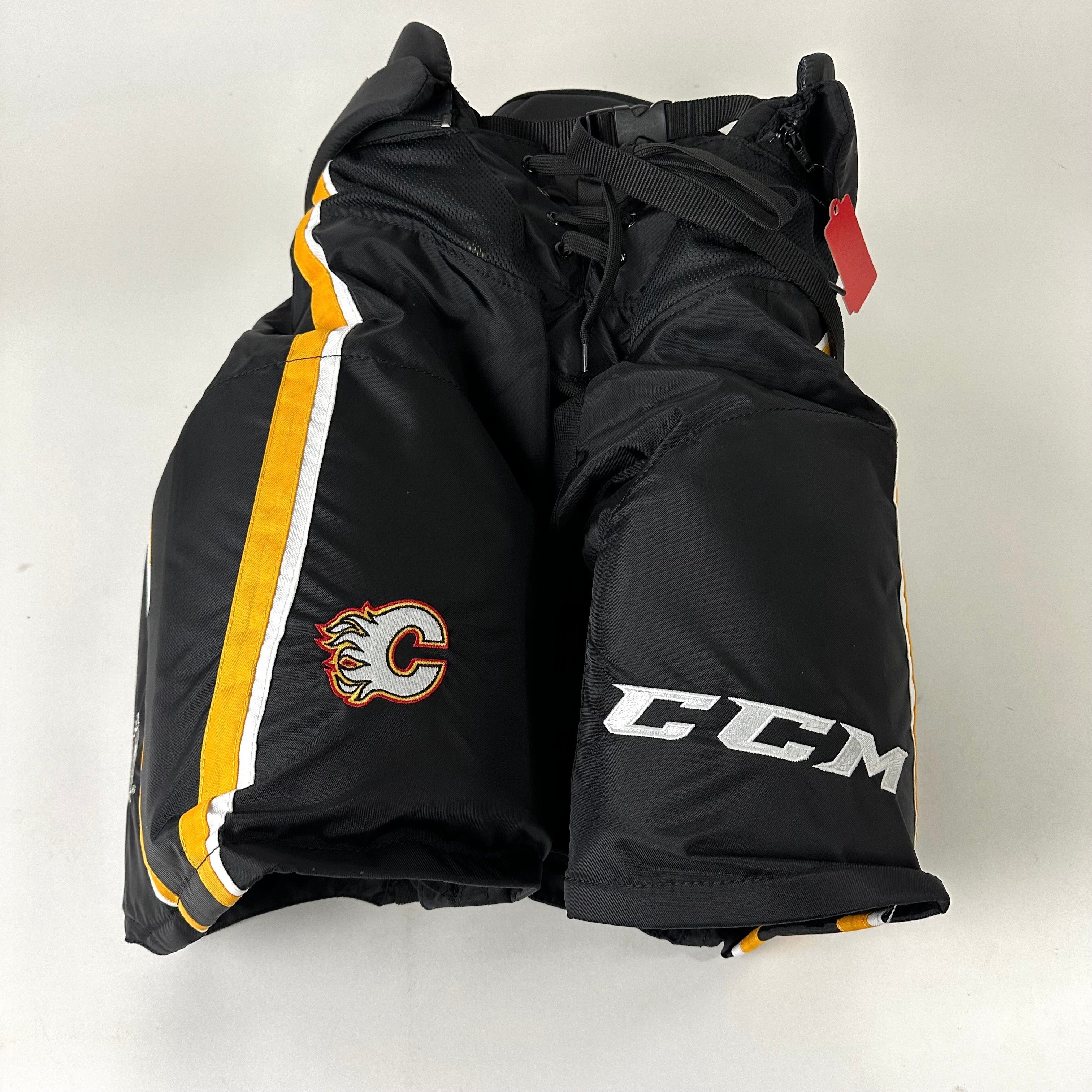 Brand New CCM HPTKXP Pro Pants - Third Calgary Flames - XL - Top Flight Hockey