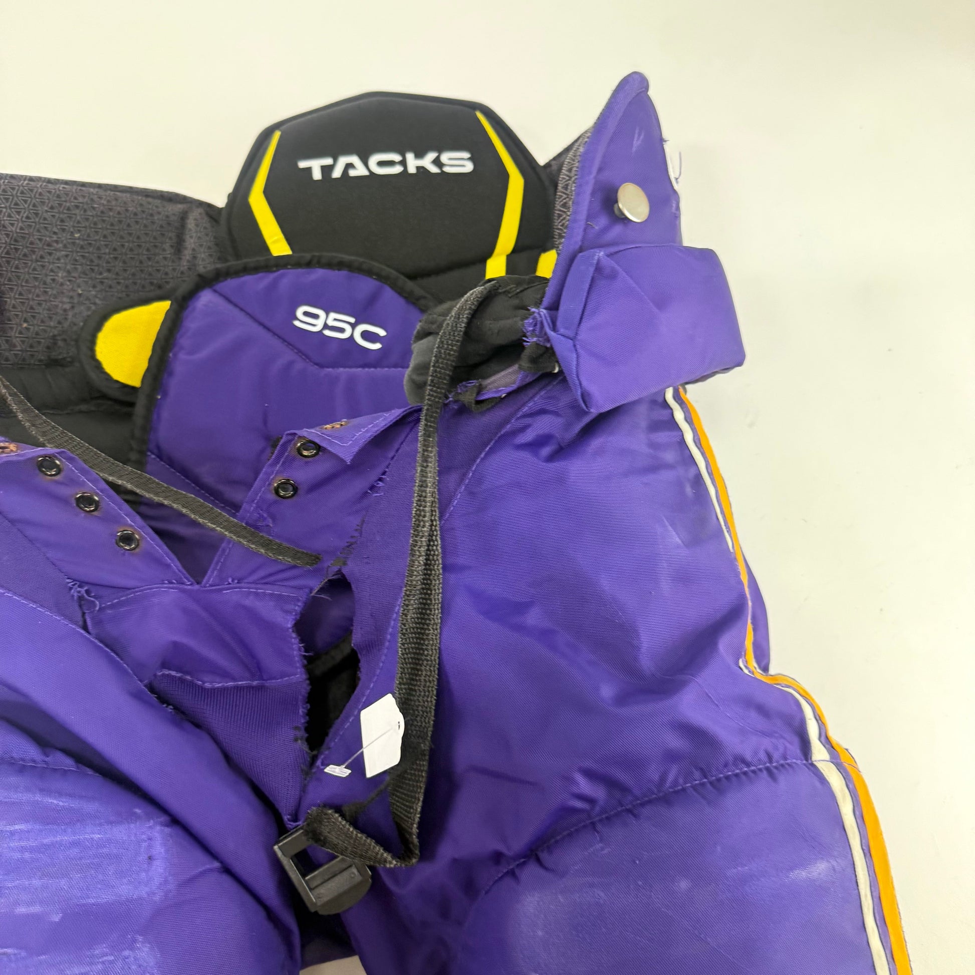 Used Purple/Yellow CCM Tacks 95C Pants | Small | E540 - Top Flight Hockey