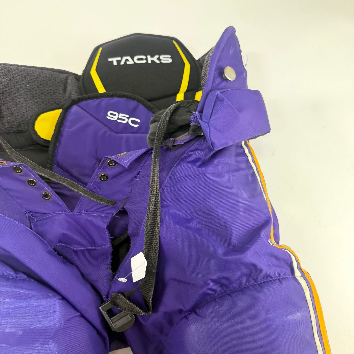 Used Purple/Yellow CCM Tacks 95C Pants | Small | E540