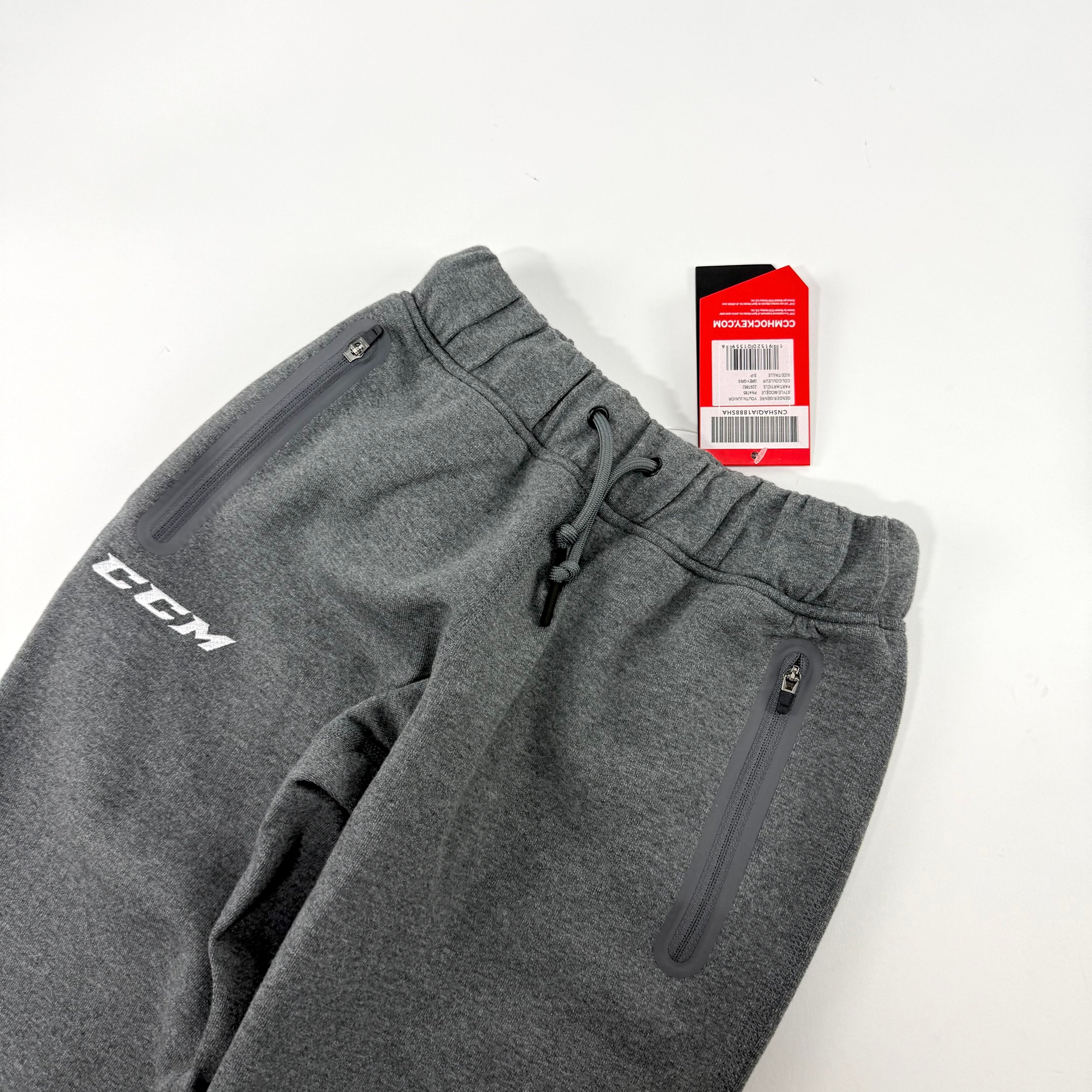 New Dark Grey CCM Youth Premium Tapered Fleece Pant | Youth S | #191520015596 - Top Flight Hockey