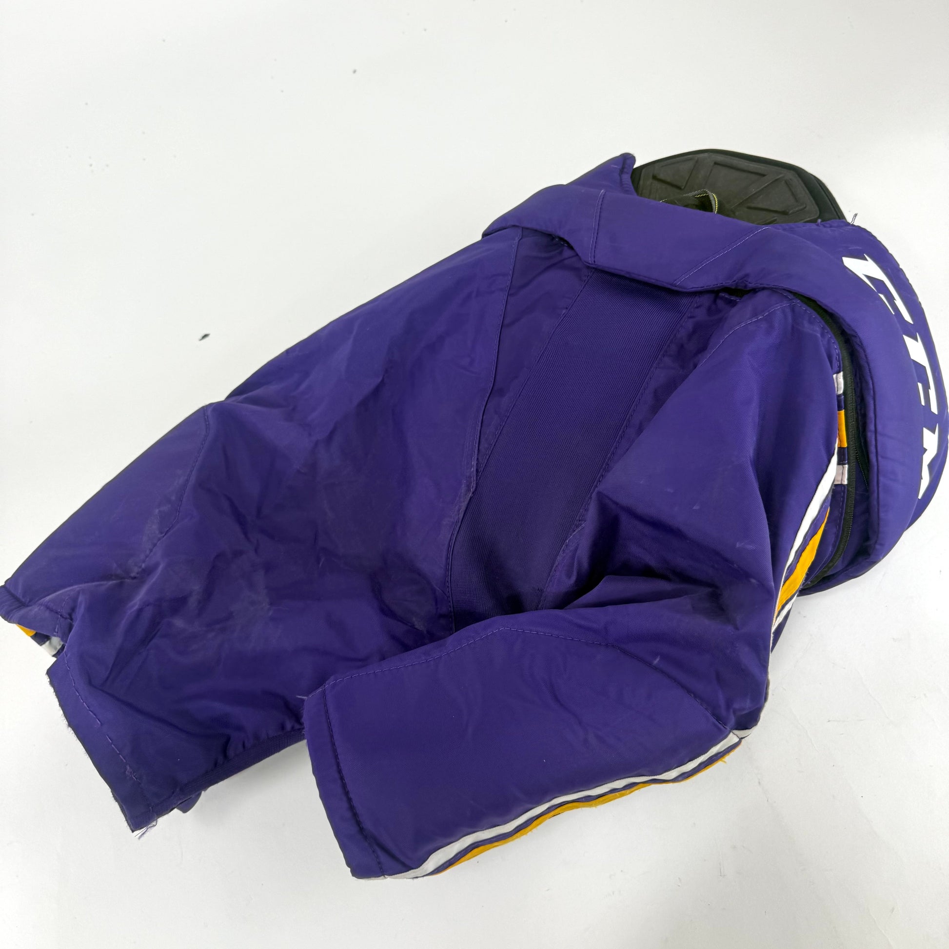 Used Purple/Yellow CCM Tacks 65C Pants | Small | E535 - Top Flight Hockey