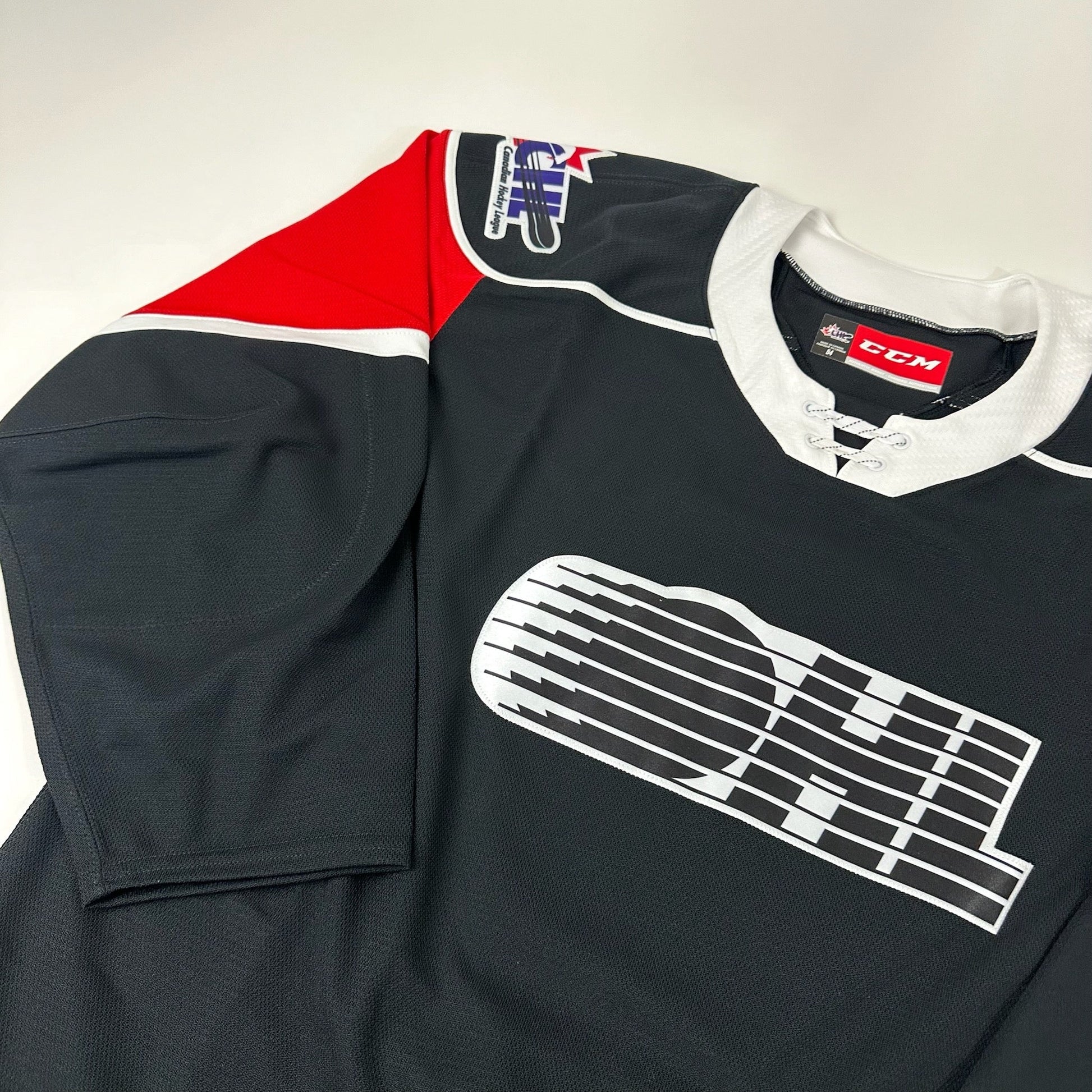 Brand New Black and Red CCM OHL MIC Game Jersey - Size 52 - Top Flight Hockey