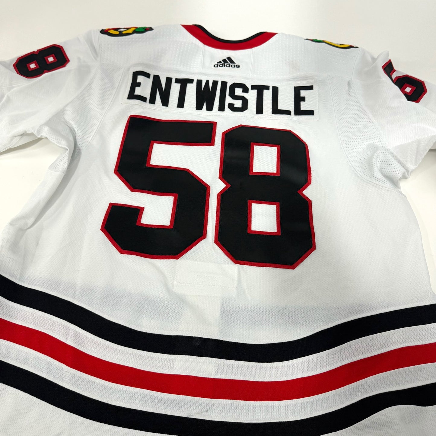 MacKenzie Entwistle #58 Away Chicago Blackhawks Game Worn Jersey 2021-2022, Set 2 | Size 58 | 8409-25551