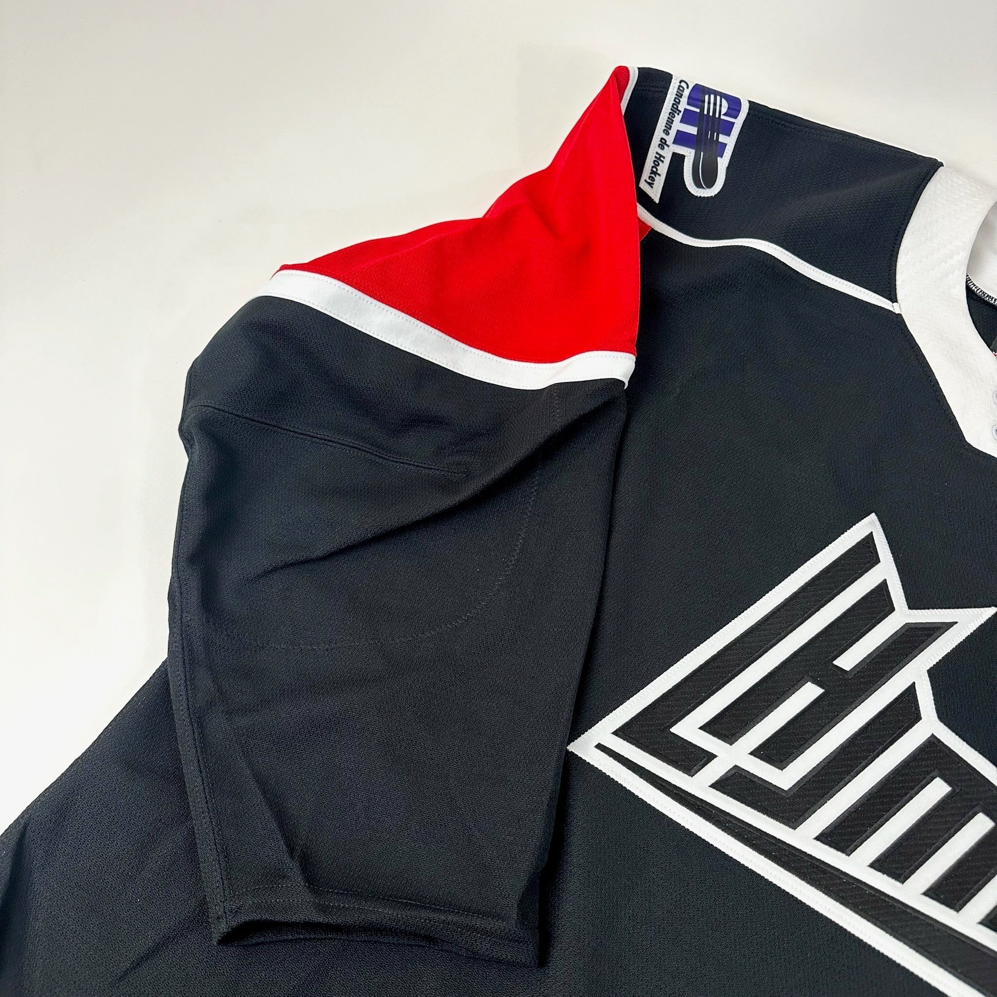 Brand New CCM Black and Red LHJMA Blank Game Jersey LCH - Size 52 - Top Flight Hockey