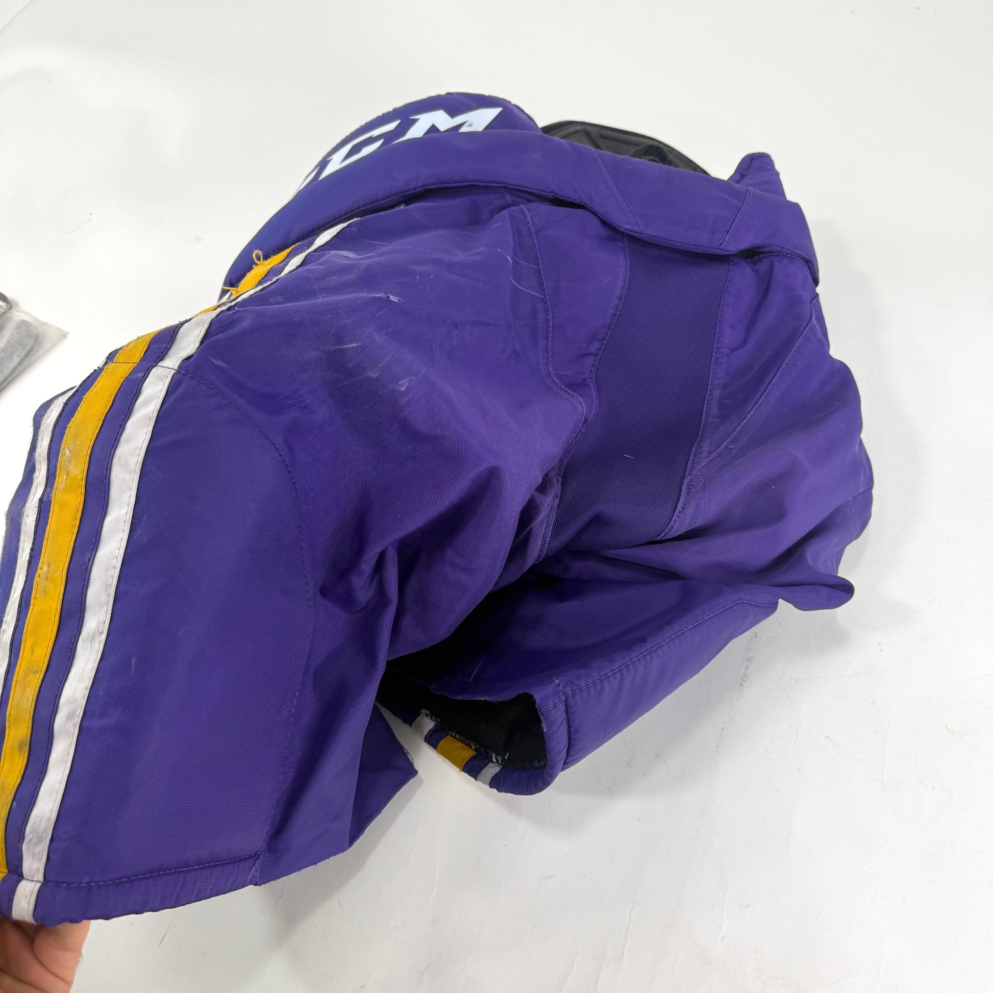 Used Purple/Yellow CCM Tacks 65C Pants | Medium | E552 - Top Flight Hockey