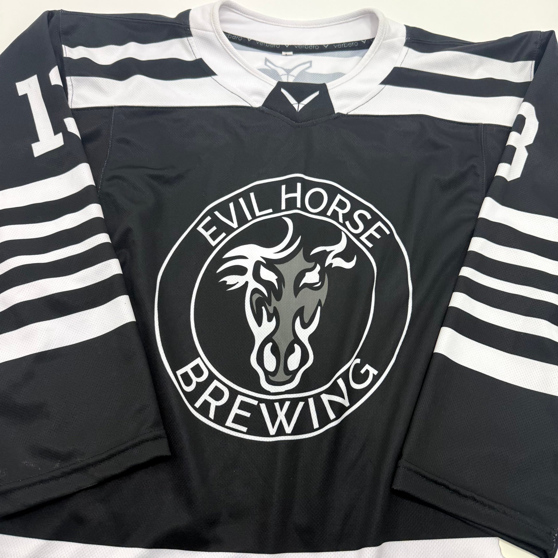 Used Black and White Verbero Evil Horse Brewing Jersey | Large | A95 - Top Flight Hockey