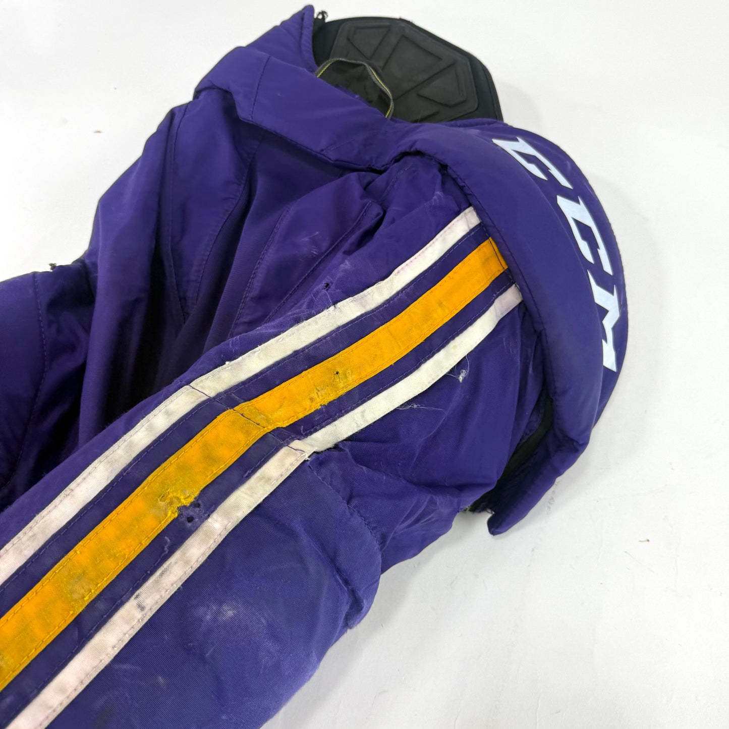 Used Purple/Yellow CCM Tacks 65C Pants | Medium | E548