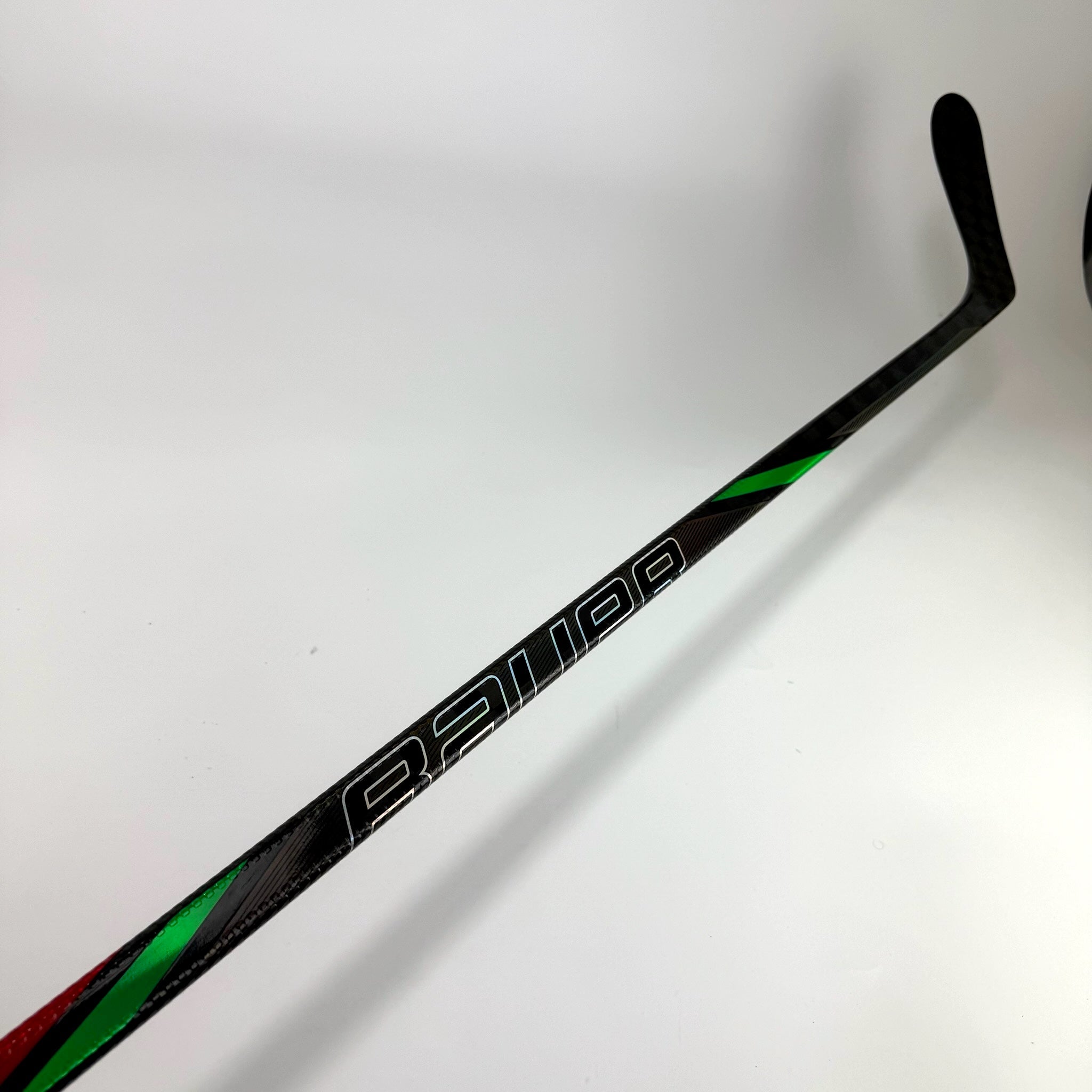 Used Left Red/Green Bauer Nexus Tracer | 82 Flex P28 Curve Grip | F339