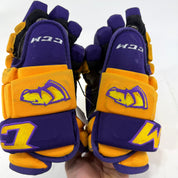 Used Yellow and Purple CCM 4 Roll Pro Gloves | 13" | E560