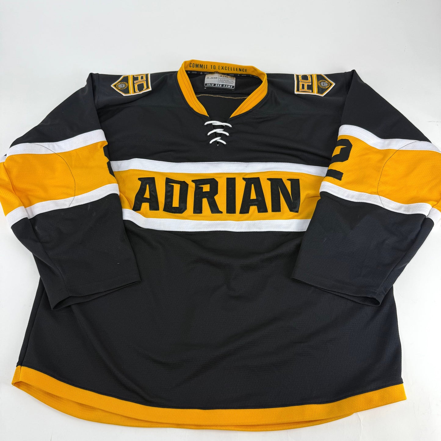 Black JOG Adrian College Game Jersey | Size 56 | Simmons-Fischer #82 - Top Flight Hockey