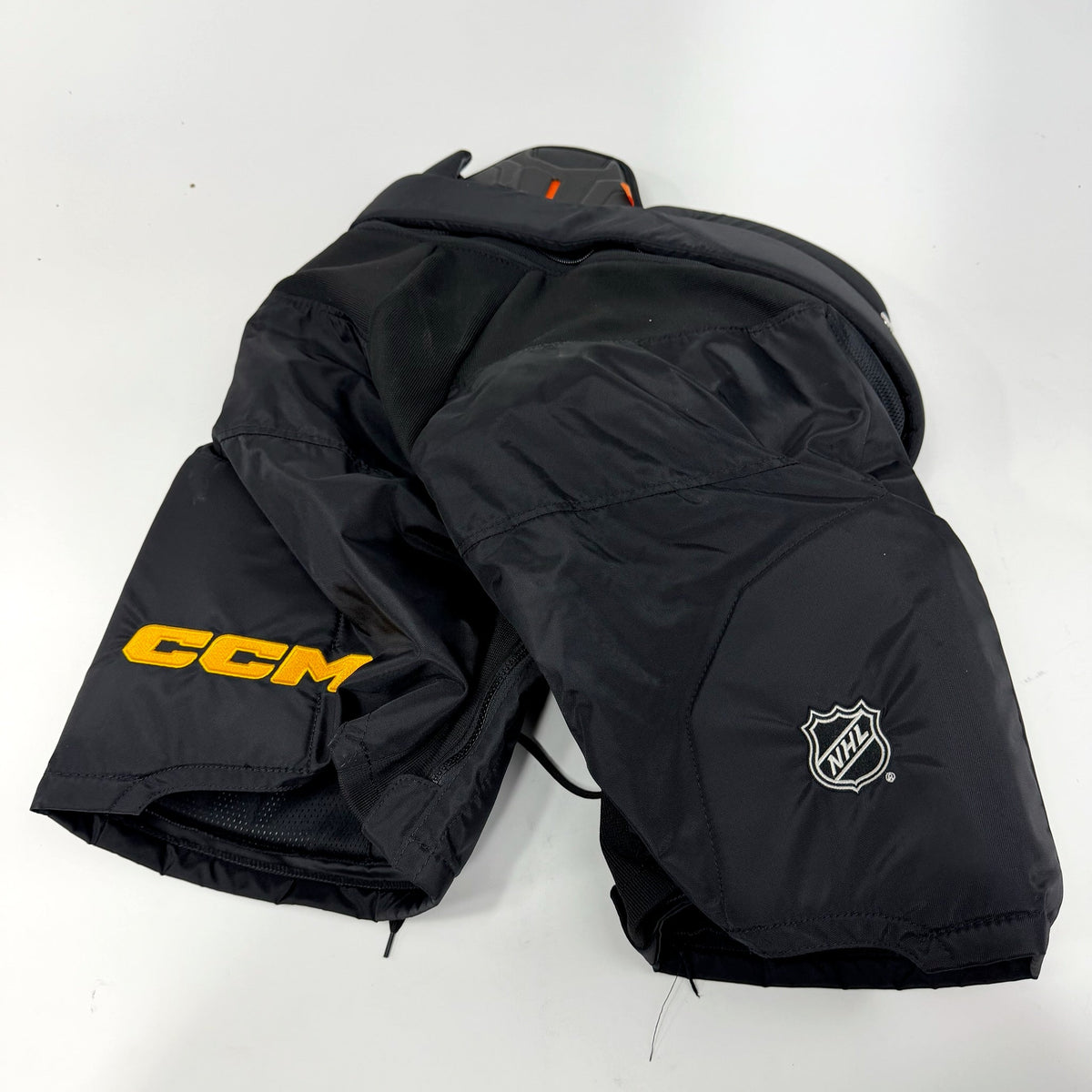 Used Black Penguins CCM HPTK Pants | Large | AB136 - Top Flight Hockey