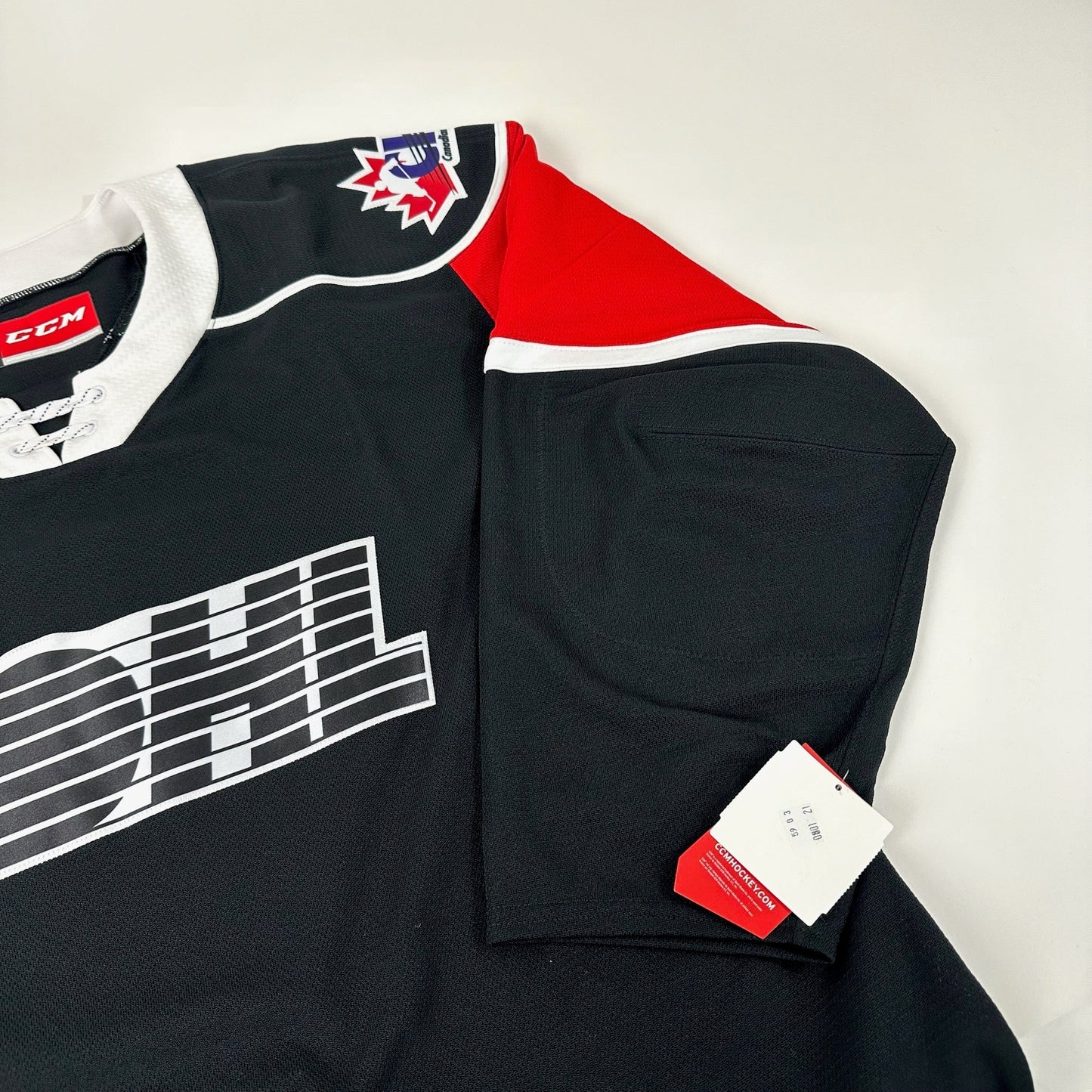 Brand New Black and Red CCM OHL MIC Game Jersey - Size 52 - Top Flight Hockey