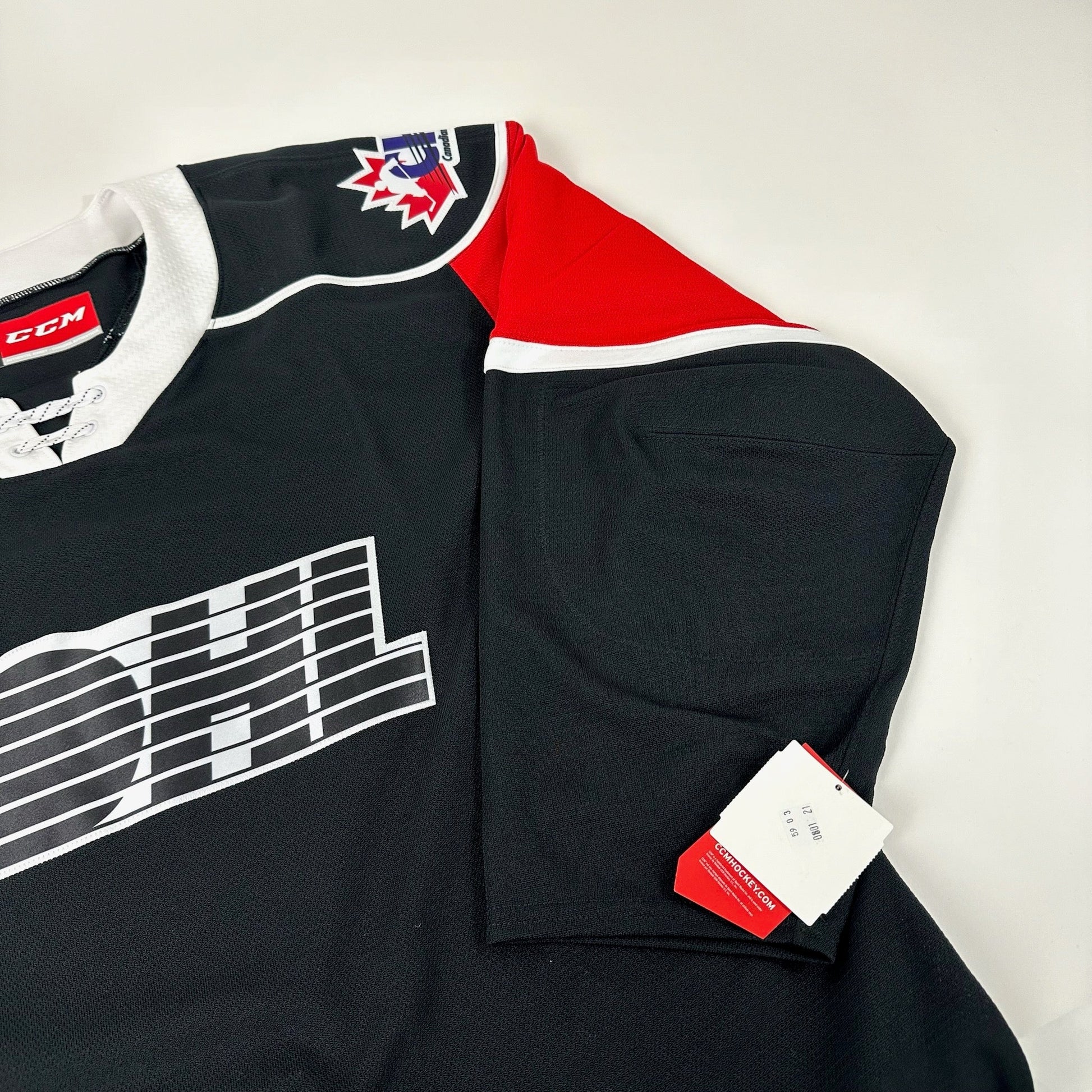 Brand New Black and Red CCM OHL MIC Game Jersey - Size 52 - Top Flight Hockey