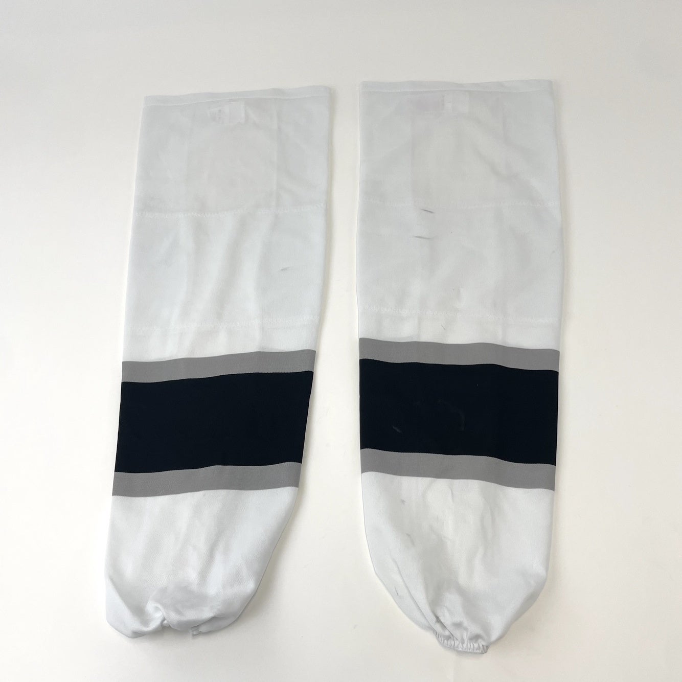 Used Once | White, Black, and Grey Ontario Reign Hockey Socks with Velcro | AHL Pro Stock - Top Flight Hockey