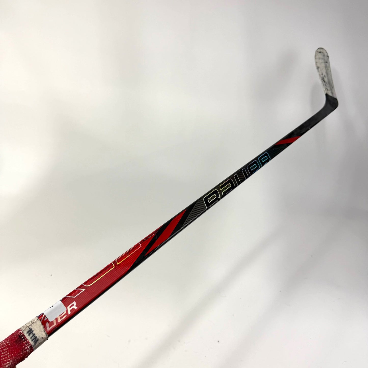 Used Left Red Bauer Nexus Tracer | 55 Flex P28 Curve Grip | AB699