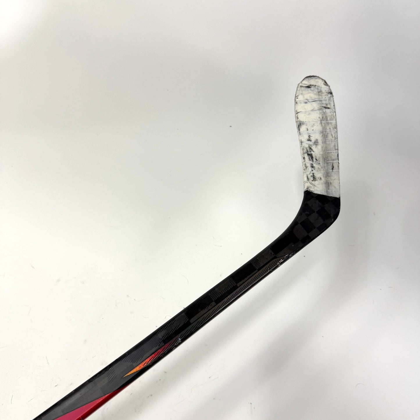 Used Left Red Bauer Nexus Tracer | 55 Flex P28 Curve Grip | AB699