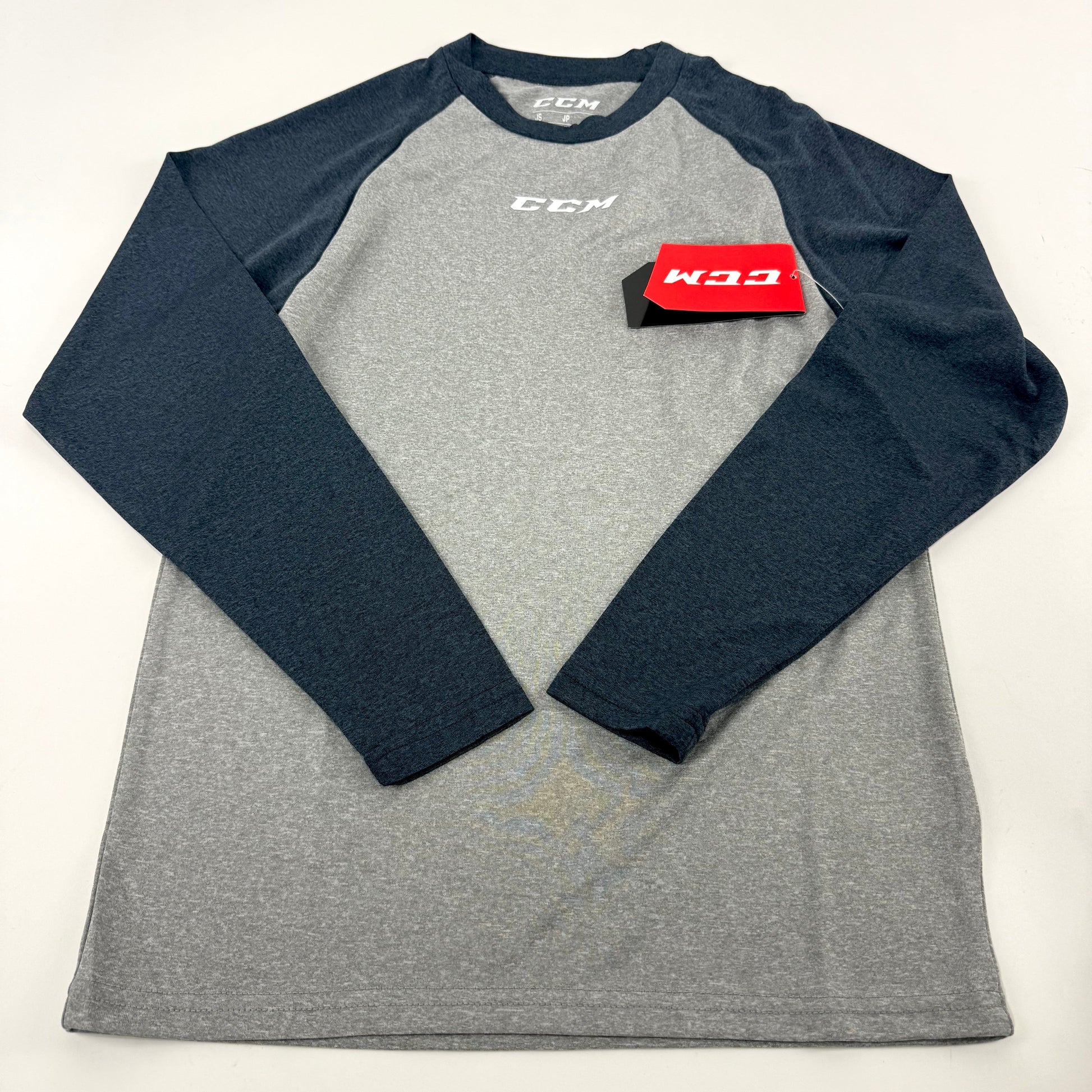 New CCM Youth Basecamp Two Tone Long Sleeve | Grey/Navy | Youth S #191520511173 - Top Flight Hockey